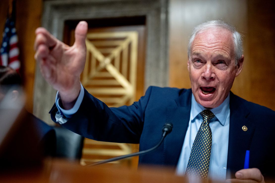 Sen. Ron Johnson, a Republican from Wisconsin, flipped through page after page of records produced by the Coast Guard that were almost entirely redacted. (Photo by Andrew Harnik/Getty Images