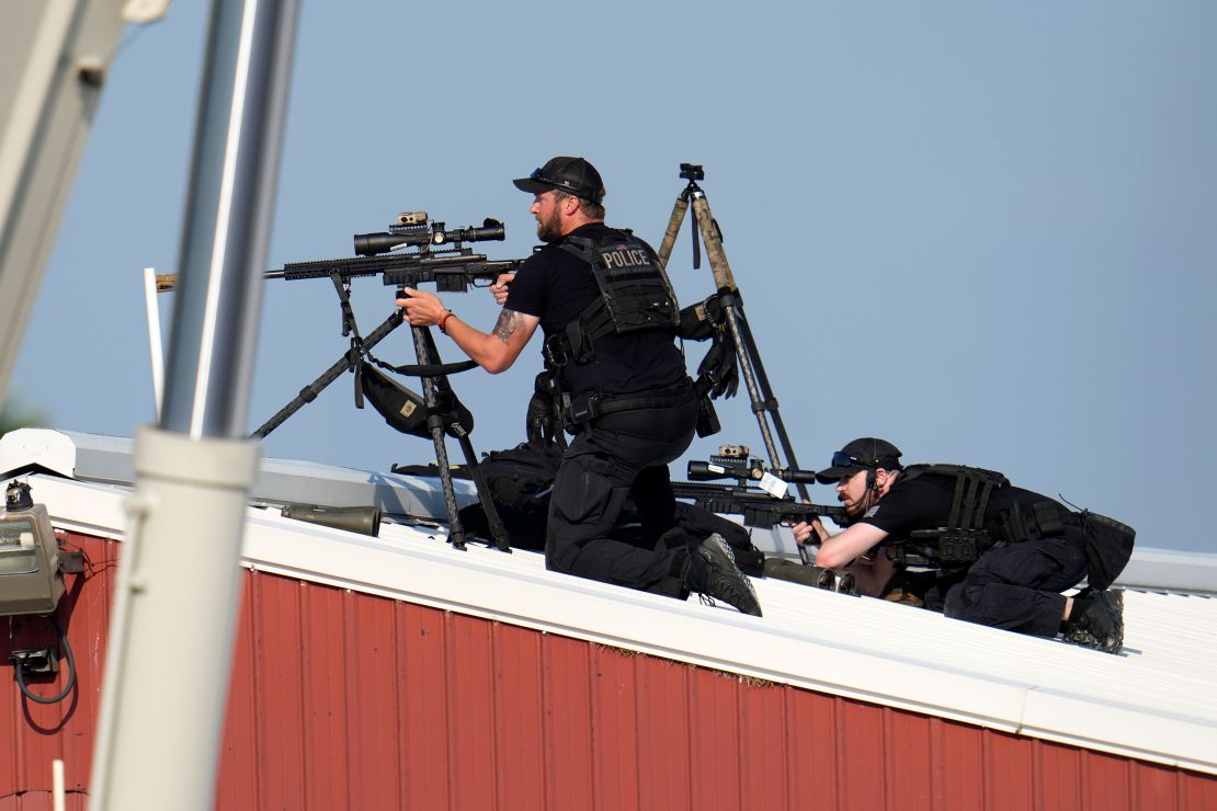 Police snipers return fire after shots were fired while Trump was speaking.